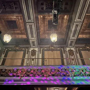 Balcony seating, some chandeliers, an oodles of architectural details
