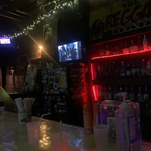 a neon lit bar counter