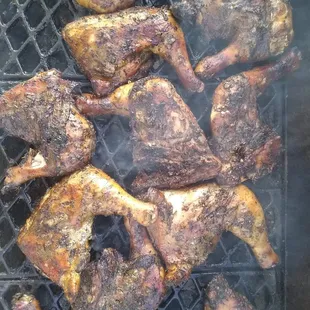 a grill full of grilled chicken