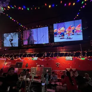 Inside. Christmas movies at the bar