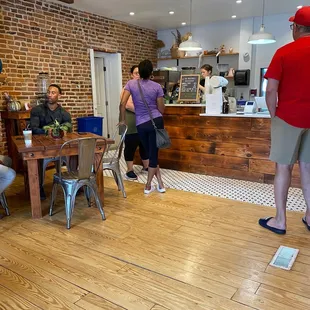 a group of people in a kitchen