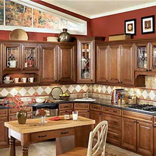 a kitchen with wood cabinets