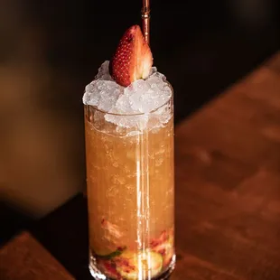 a drink with a strawberry on top