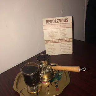 a tray with two glasses of wine on it