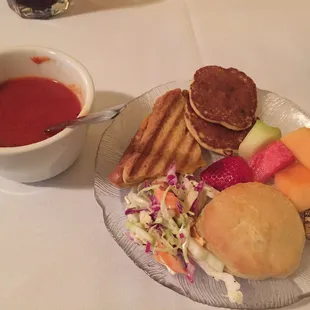 Tomato soup with grilled cheese sandwich, fruit, dinner roll, corn cakes &amp; coleslaw