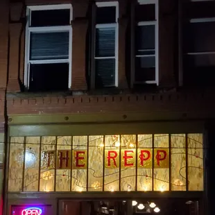 The gorgeous front window of this restaurant, which is especially breathtaking after dark