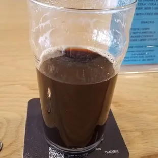 a cup of coffee on a coaster