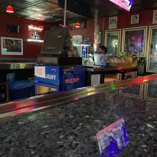 a reflection of a bar counter