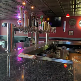 a view of a bar with a drink on the counter