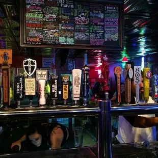 a bar filled with beer taps