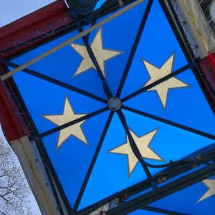 a blue and white sign with stars