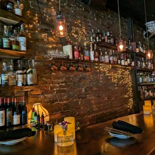 a bar with bottles of alcohol
