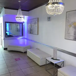 the lounge area with chandeliers