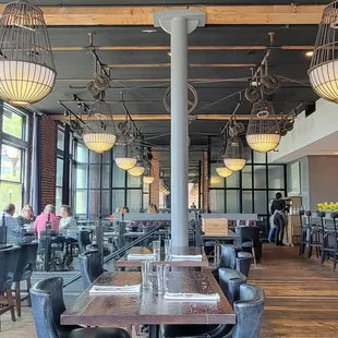 a dining area with tables and chairs