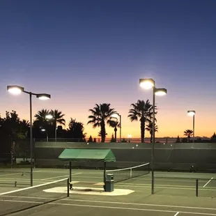 Sunset on their newly remodeled clay courts
