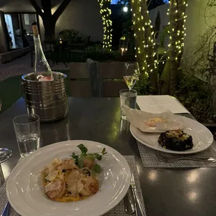 Delicious Salmon En Papillote and Handmade Fettuccine with pan-seared scallops.