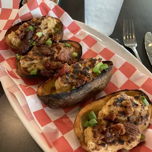 Loaded Canoes - fried potato boats stuffed with cheddar, cream cheese, bacon and green onions. Can add pimento cheese.