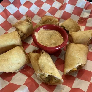 Southwest Egg Rolls - stuffed with chicken, cheese, black beans, corn and peppers, served with chipotle ranch.