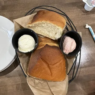 Fresh bread with regular butter and strawberry butter.