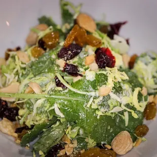 Kale &amp; Brussel sprouts salad, dried cranberries, raisons, almonds, with a mustard vinaigrette