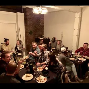a group of people sitting around a table