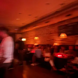 a blurry image of people sitting at tables