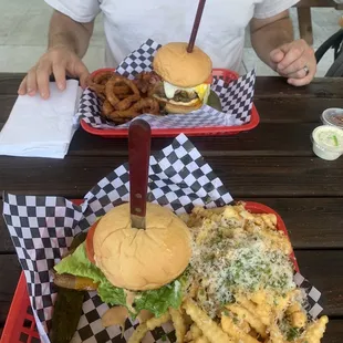 Crispy chicken burger with garlic fries and Kevin Funk burger with onion rings