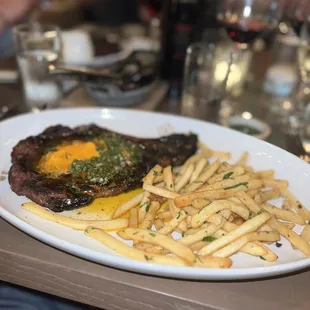 grilled bone-in ribeye with frittes