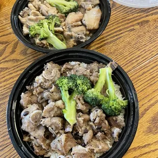 Chicken with Dried Mushrooms Clay Pot Rice (back) and Pork Ribs in Black Bean Sauce Clay Pot Rice. To-go