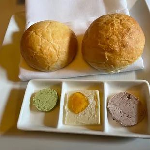 Warm house rolls with three butters, herb, honey and olive