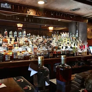 a bar filled with liquor bottles