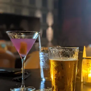 two glasses of beer and a martini