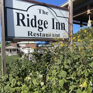 a sign for the ridge inn