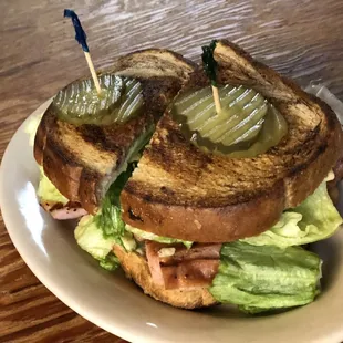 a grilled sandwich with pickles