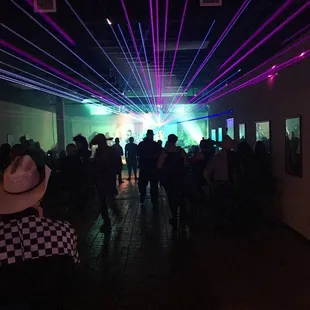 a crowd of people in a dark room