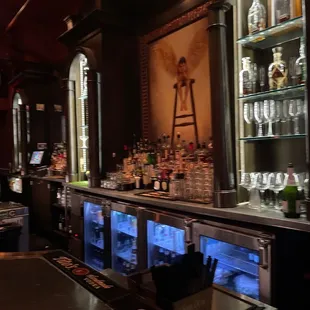 a bar with a lot of bottles