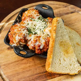 a piece of bread and a meat dish