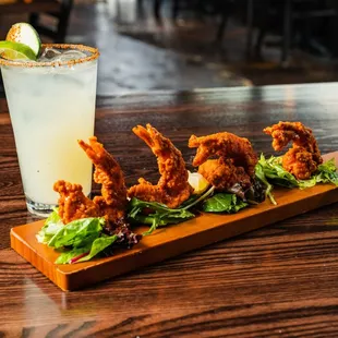 a cocktail and fried shrimp