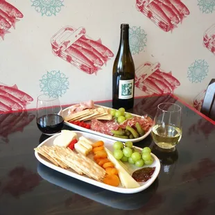 a plate of food and a glass of wine