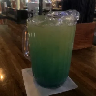 a green drink in a glass