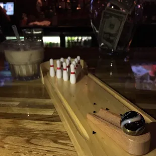 Mini bowling games while you hang out at the bar