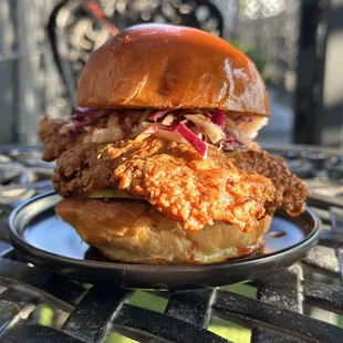 marinated organic chicken breast, brioche bun, vinaigrette slaw, pepper jack cheese, house pickles, remoulade, tangy house hot sauce