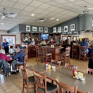 people sitting at tables and eating