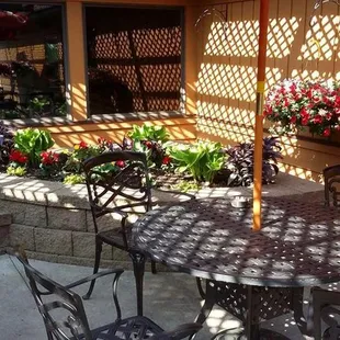 a patio with a table and chairs