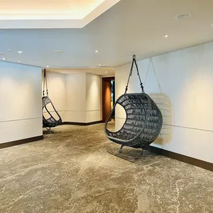 Hanging chairs in the hallway.