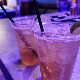 a close up of two glasses of drink