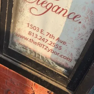 the reflection of a sign in a window