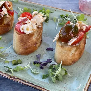 four appetizers on a plate