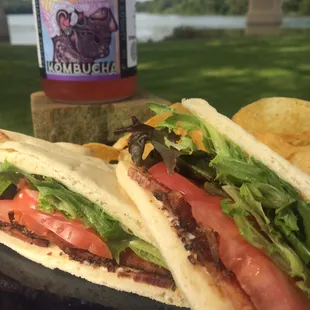 BLT on Naam flatbread~ premium peppered bacon with fresh spring mix and tomatoes! Yum.