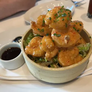 a bowl of shrimp with sauce